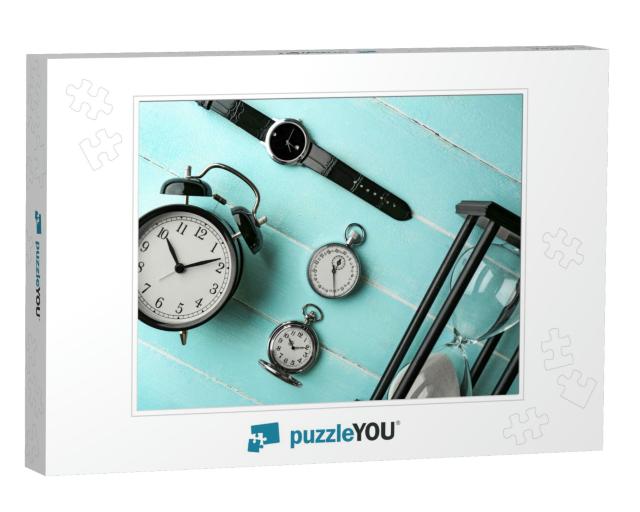 Different Kinds of Watches on Light-Blue Table... Jigsaw Puzzle