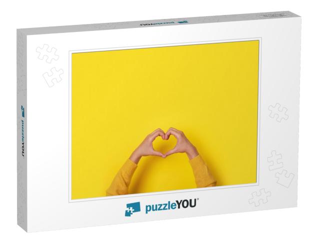 Hands Making Heart Shape, Love Symbol Over Yellow Backgro... Jigsaw Puzzle