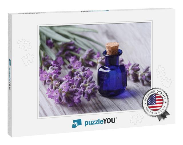 Lavender Oil in a Glass Bottle on a Background of Fresh F... Jigsaw Puzzle