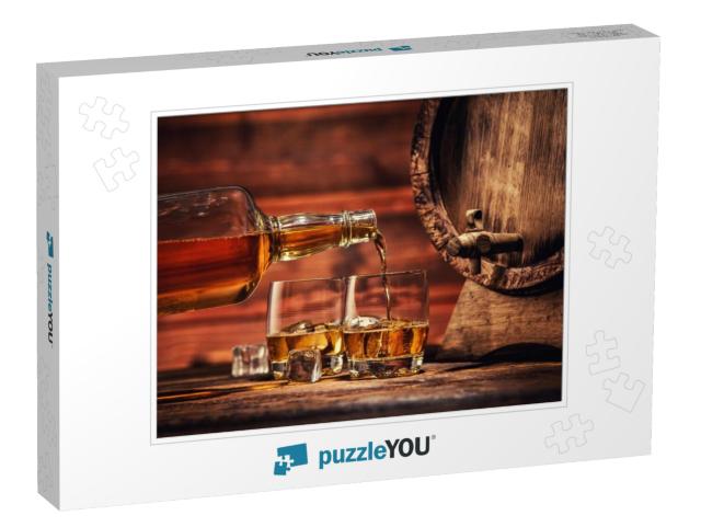 Pouring Whiskey from Bottle to Two Glasses with Ice Cubes... Jigsaw Puzzle