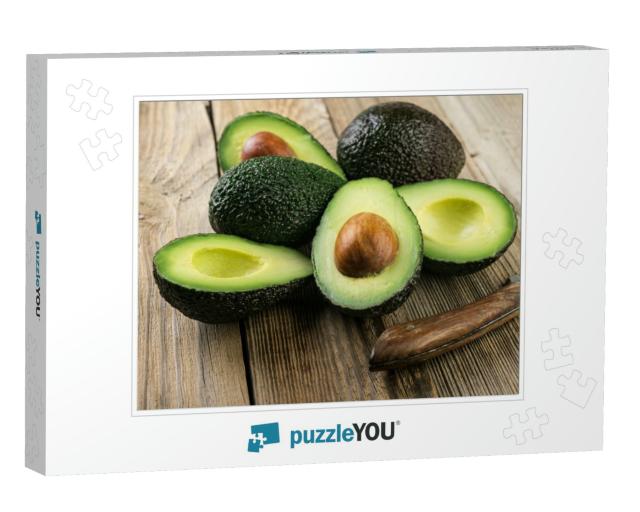 Fresh Sliced Avocado on Wooden Table. Vegetarian Food Con... Jigsaw Puzzle
