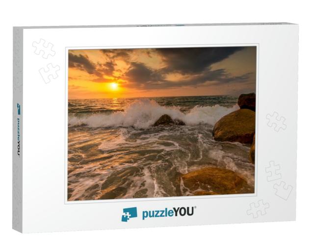 A Sunset Ocean Wave is Breaking on the Sea Shore with the... Jigsaw Puzzle