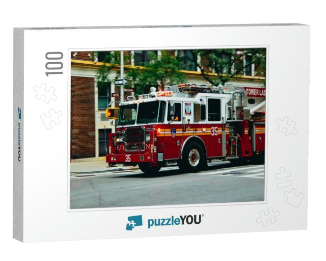 Nyc Firetruck Driving on a Road... Jigsaw Puzzle with 100 pieces