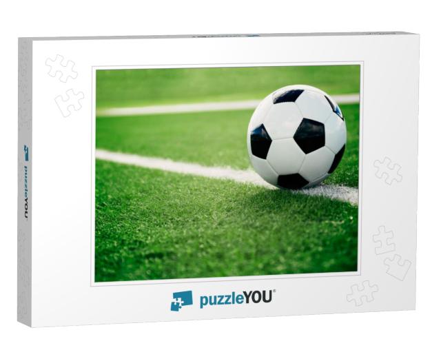 Traditional soccer ball on soccer field Jigsaw Puzzle