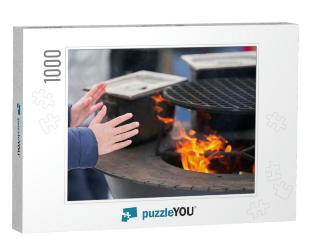 A Child Warms His Hands Over the Fire of a Street Grill... Jigsaw Puzzle with 1000 pieces