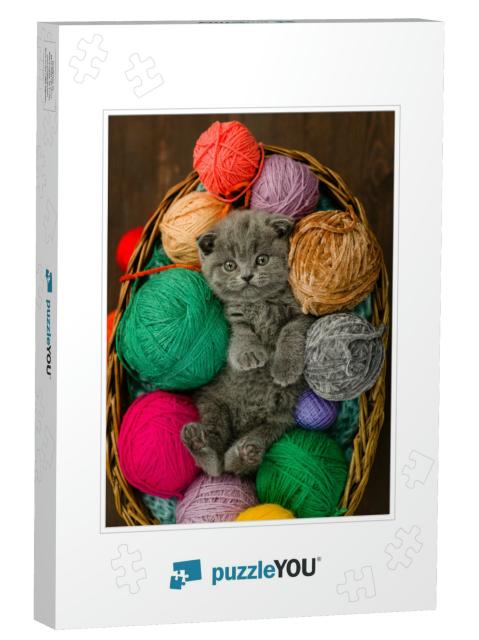 Cute Kitten Lies Inside a Basket with Clews of Thread. To... Jigsaw Puzzle